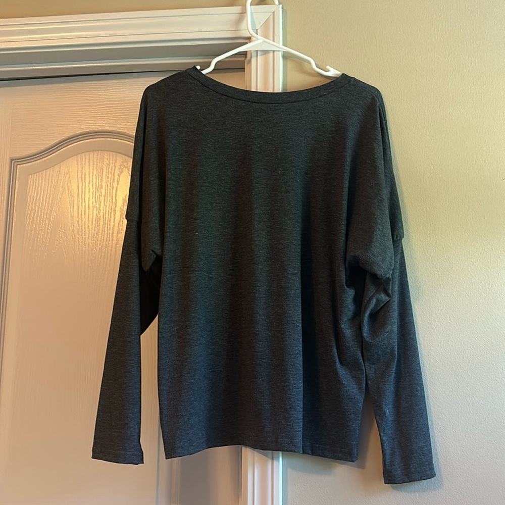 Light weight, long sleeved top. Never worn